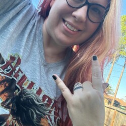 Holisticfox spotted channeling 20% peace, 80% pandemonium. Lisa wearing a Hellion shirt outside.