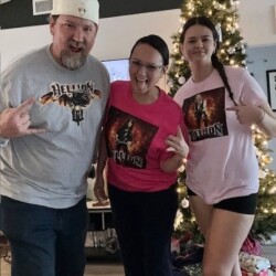 Raised on Good Taste and Metal Mania... Here's Haley with mom Jasmine and Dad Jimmy. Jimmy, wife, daughter...wearing Hellion merch.